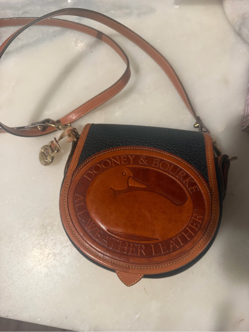 Dooney & Bourke Black and Brown Round Leather Crossbody